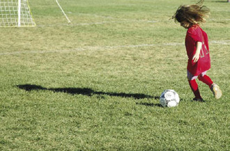 Girl playing soccer